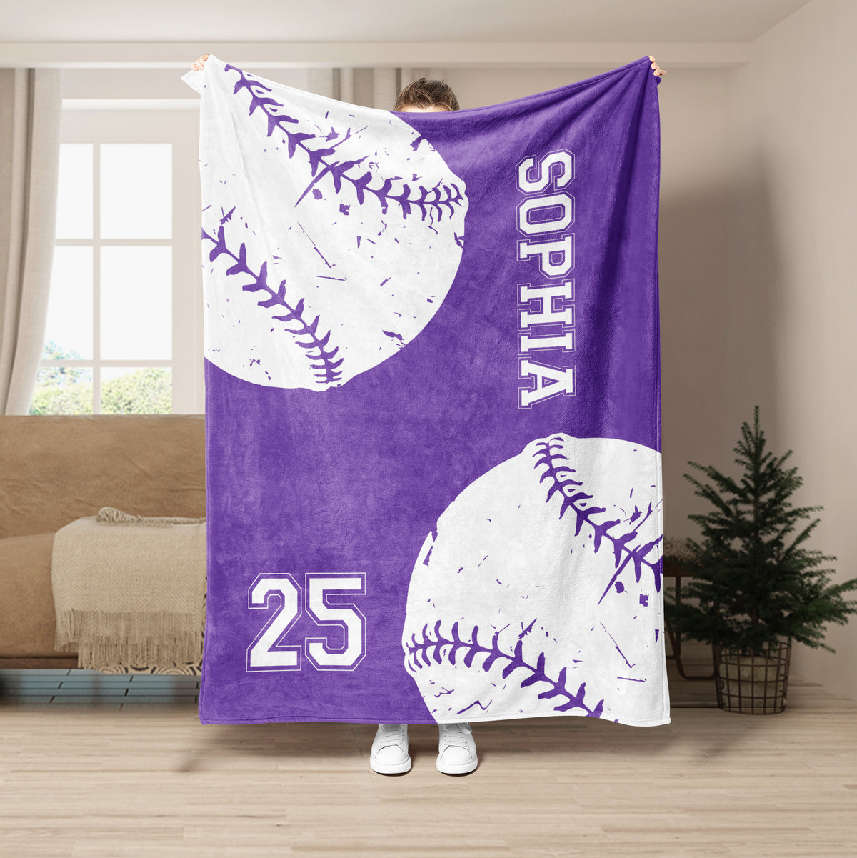 Purple softball throw blanket displayed with oversized white stitched balls and bold sports artwork