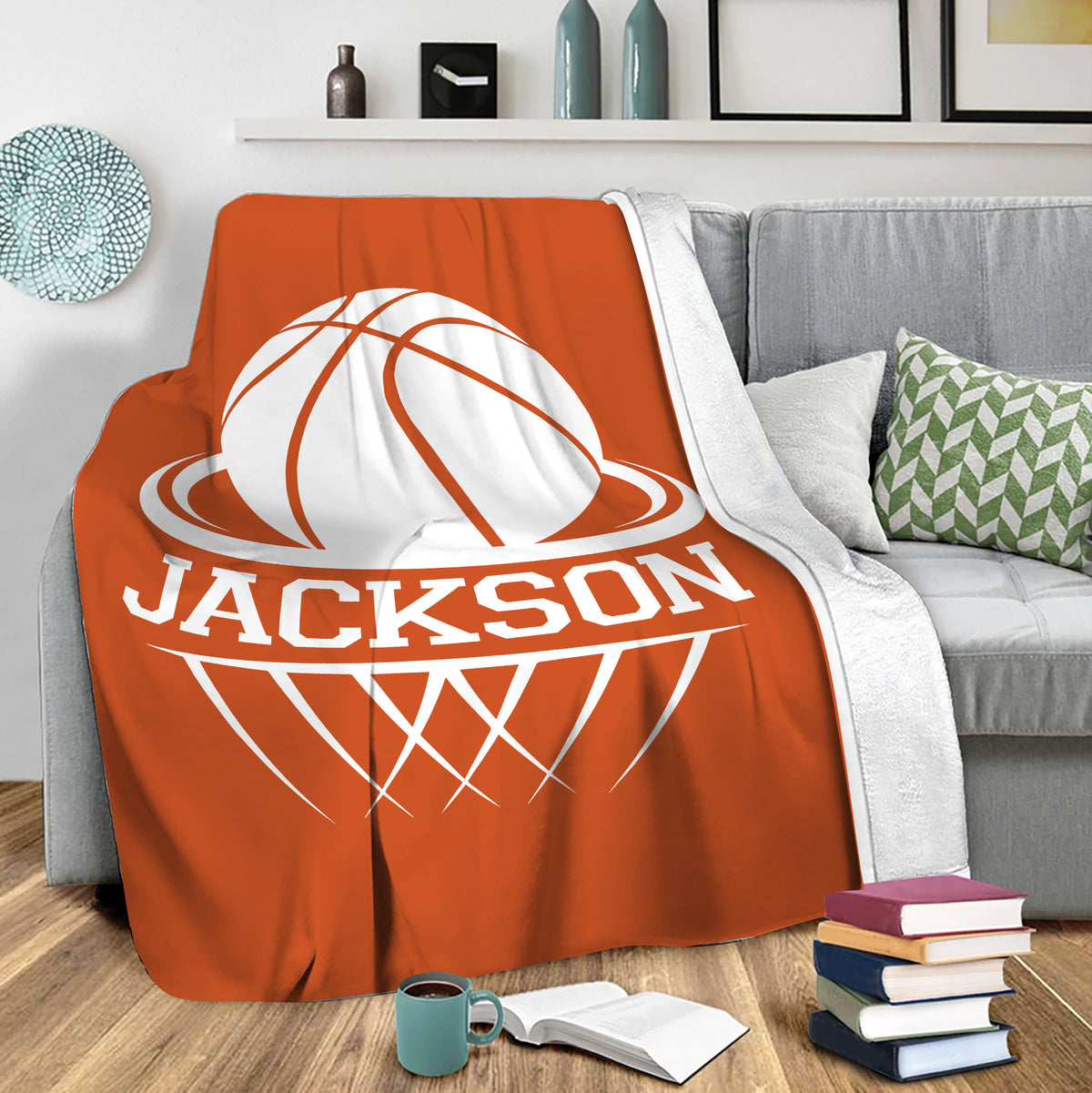 Orange basketball blanket draped over a gray sofa in a cozy living room