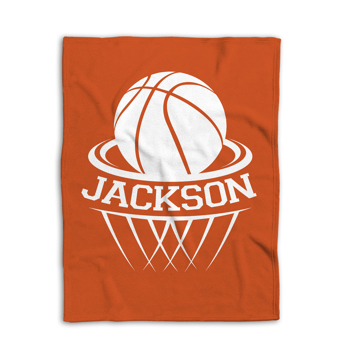 Flat lay of an orange basketball blanket with large white basketball and hoop design