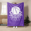 Purple basketball throw blanket displayed in a living room with white basketball artwork