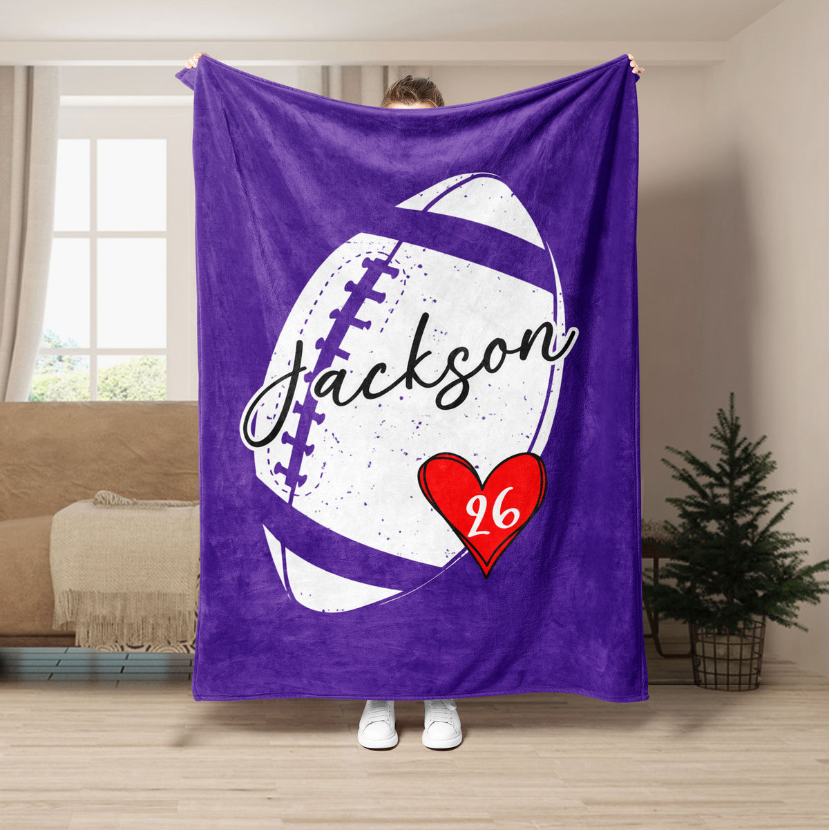 Purple football throw blanket featuring graphic football artwork and a red heart accent