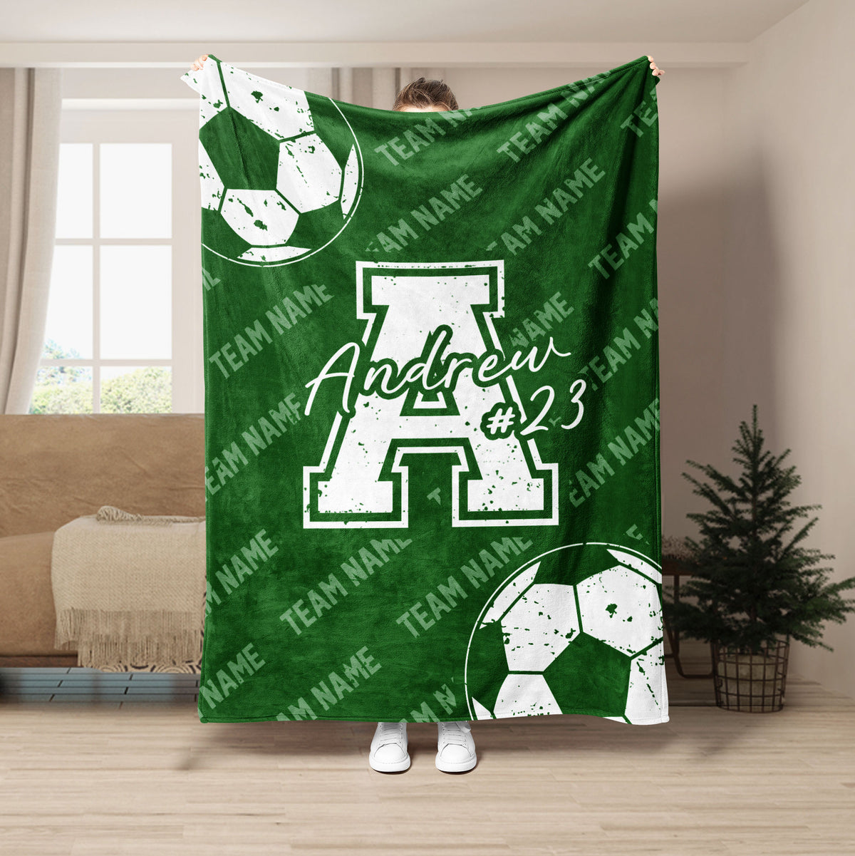Green soccer throw blanket with white soccer ball graphics and bold athletic team artwork
