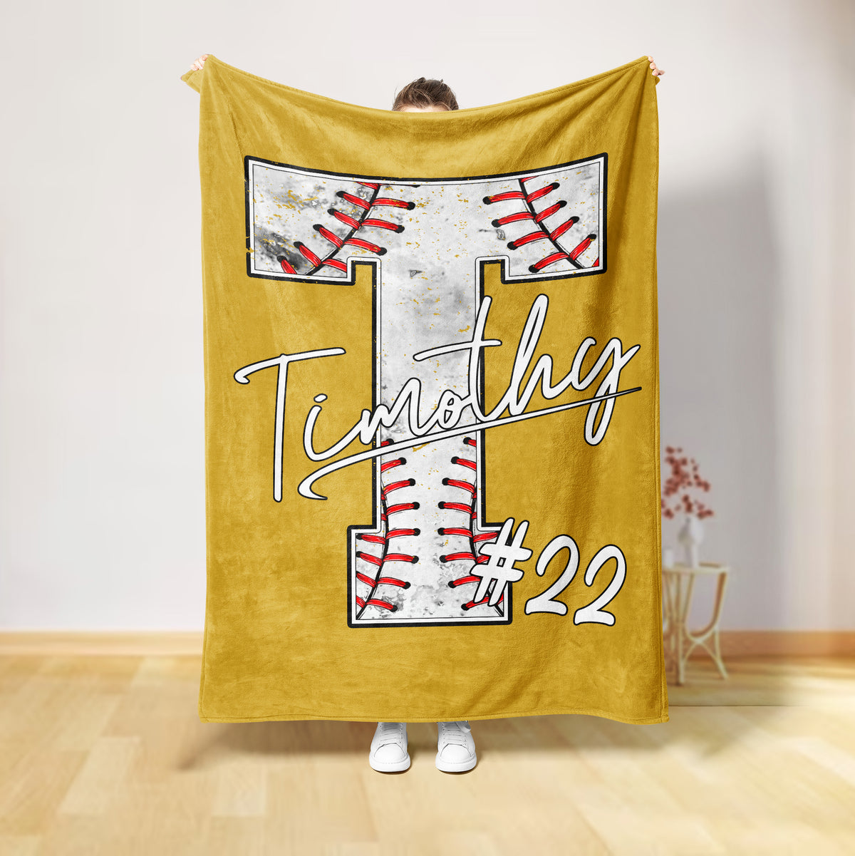 Gold baseball throw blanket featuring a large stitched baseball design and bold sports artwork