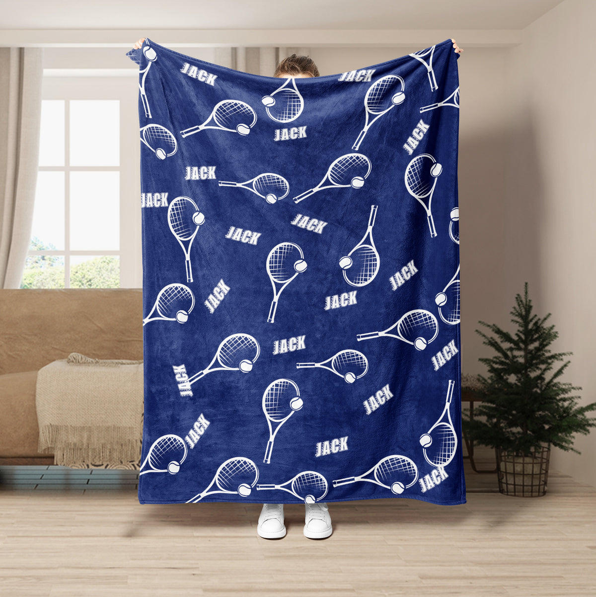 Blue tennis blanket featuring repeating white tennis rackets and tennis balls