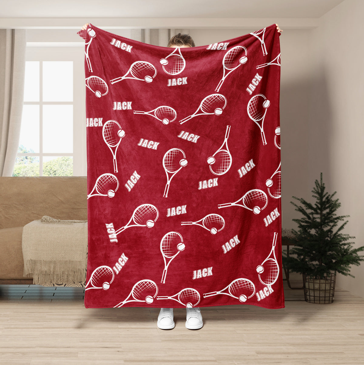 Red tennis throw blanket with white racket and tennis ball pattern