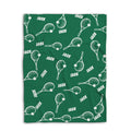 Folded green tennis blanket with repeating white racket and tennis ball artwork