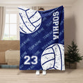 Blue volleyball throw blanket shown in a room with large distressed volleyball graphics and sports lettering