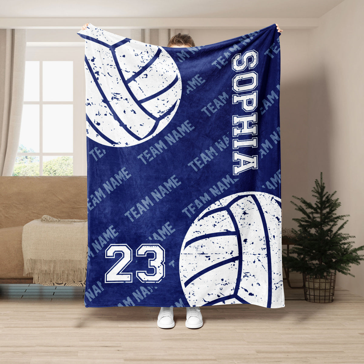 Blue volleyball throw blanket shown in a room with large distressed volleyball graphics and sports lettering