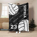 Black volleyball throw blanket featuring white distressed volleyball artwork and bold sports-inspired design