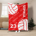 Red volleyball throw blanket with white distressed volleyball graphics and energetic sports team styling