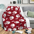 Red football blanket draped over a sofa, creating bold sports decor for a cozy lounge