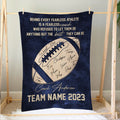 Football coach blanket displayed on a wooden frame with team-inspired artwork