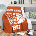 Orange basketball throw blanket draped over a sofa in a living room