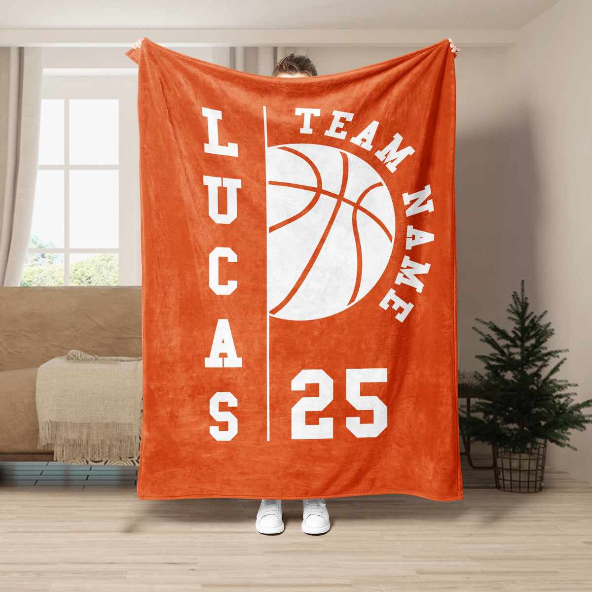 Orange basketball throw blanket featuring a large white basketball and team-style graphic