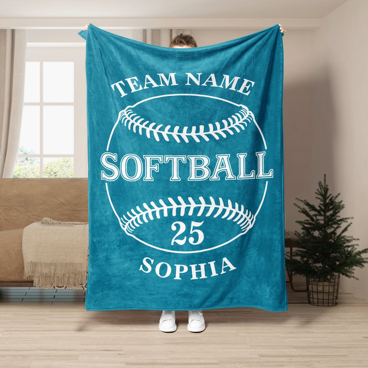 Teal softball throw blanket displayed with a bold white softball design