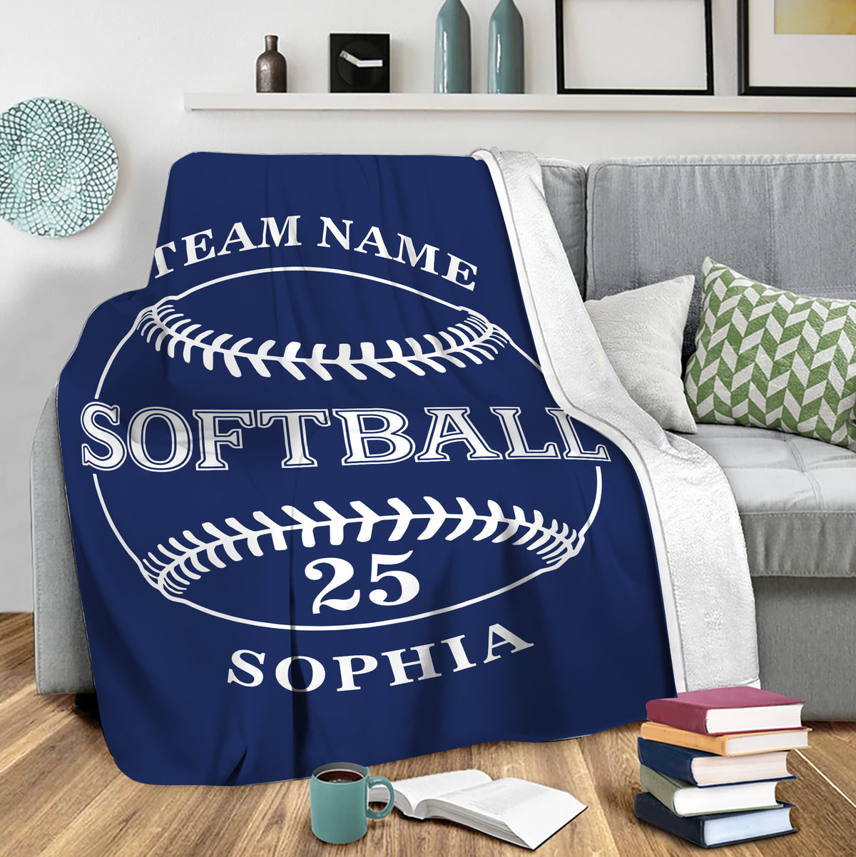Navy softball throw blanket draped over a sofa in a comfortable living room