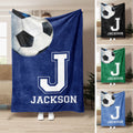 Soccer throw blanket with oversized soccer ball, bold athletic letter design, and multiple color options