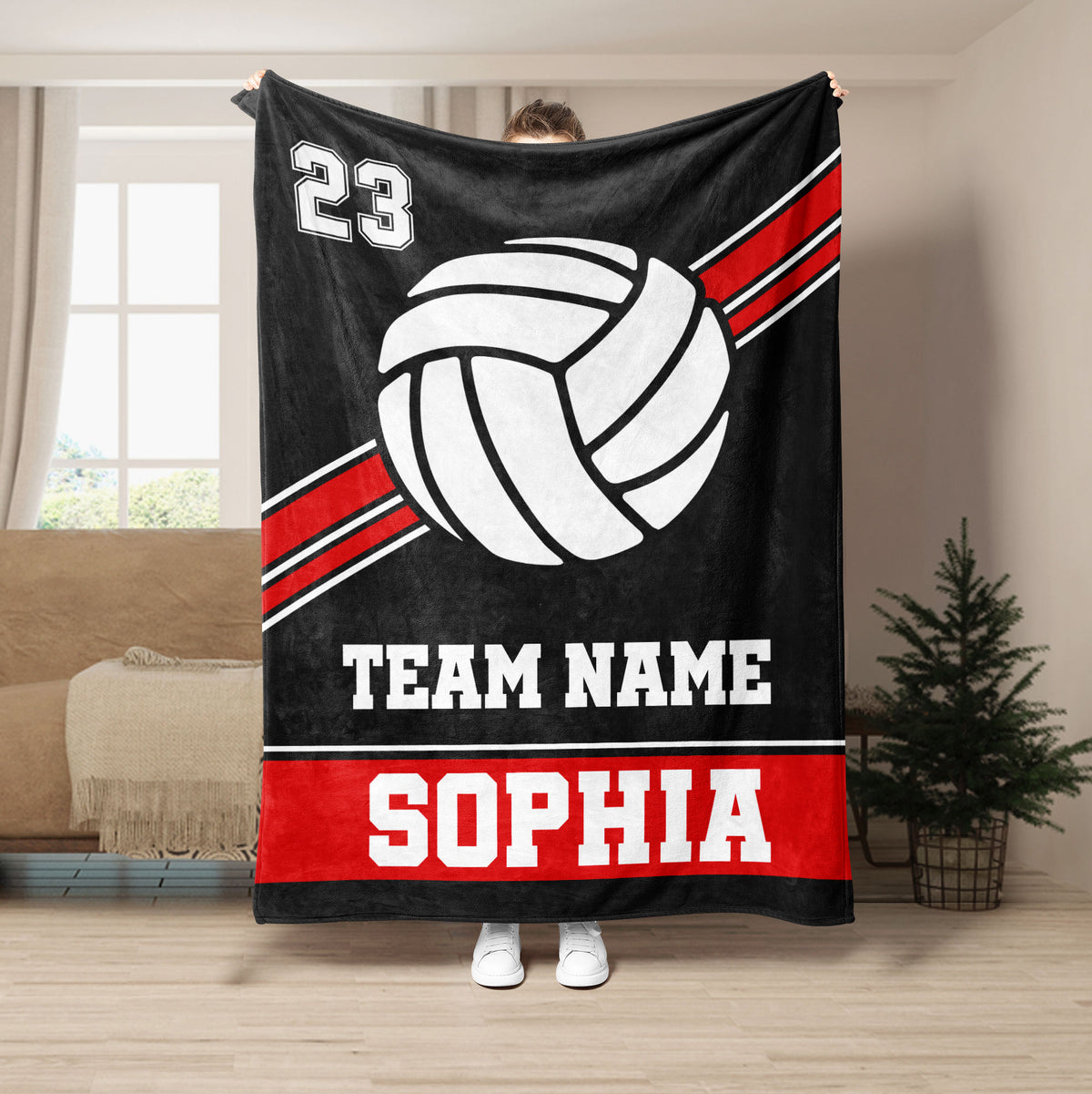 Black volleyball throw blanket featuring bold white volleyball artwork and red athletic stripes