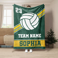 Green volleyball throw blanket featuring a large white volleyball and gold athletic stripes