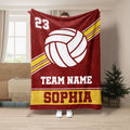 Maroon volleyball throw blanket featuring bold white volleyball artwork and gold athletic stripes