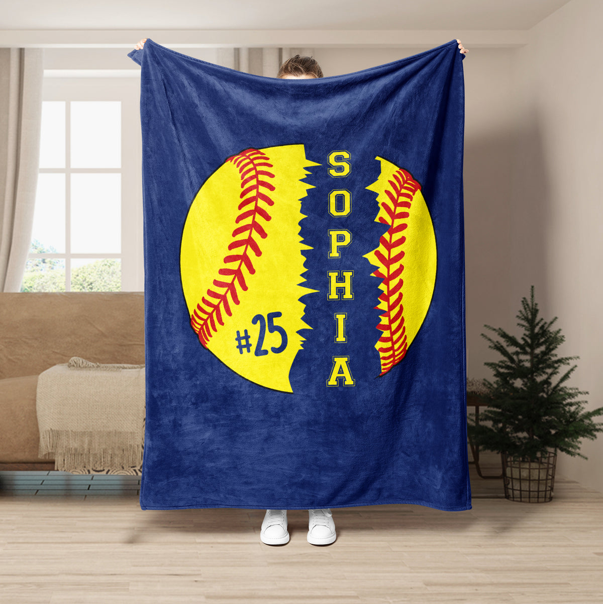Blue softball throw blanket featuring a large yellow softball graphic with red stitching