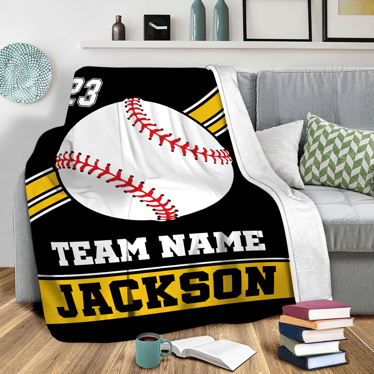 Baseball throw blanket draped over a sofa with bold black, white, and yellow sports artwork