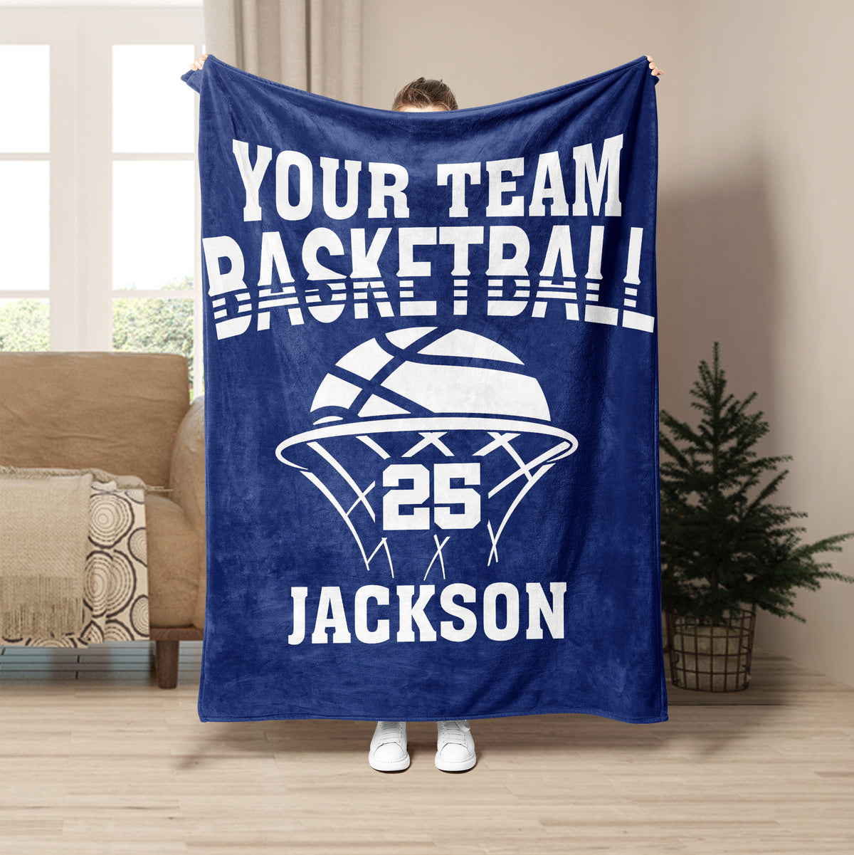 Blue basketball throw blanket displayed with bold white basketball artwork in a living room