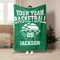 Green basketball throw blanket displayed with white basketball artwork in a living room