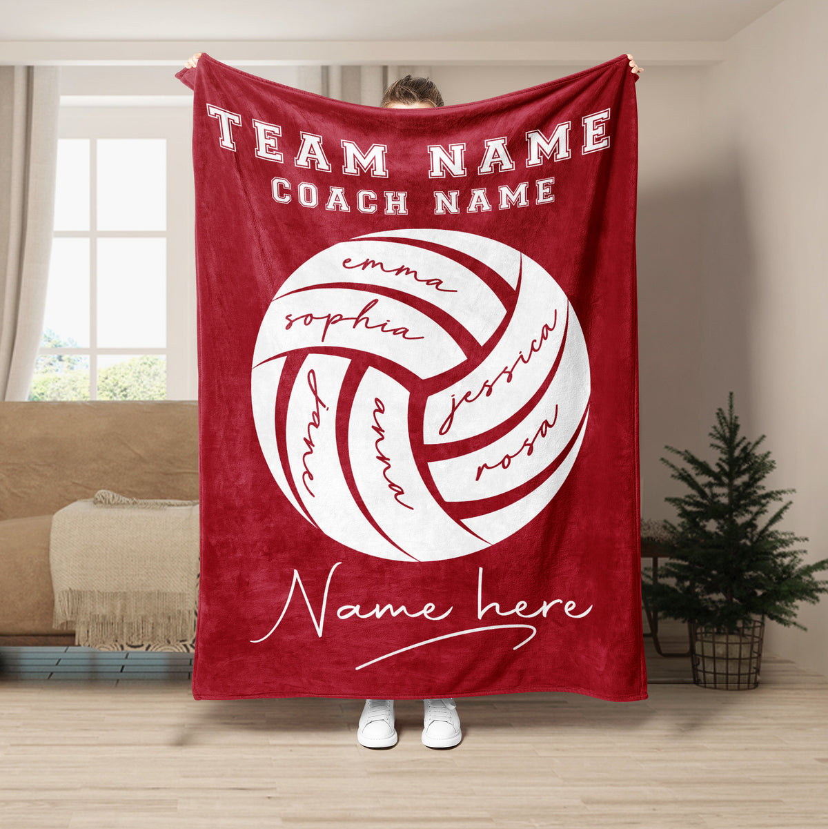 Red volleyball throw blanket shown in a bright living room with bold team sports artwork