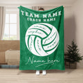 Green volleyball throw blanket displayed in a living room with contrasting white sports artwork