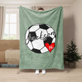 Sage green soccer blanket displayed with black and white soccer ball artwork