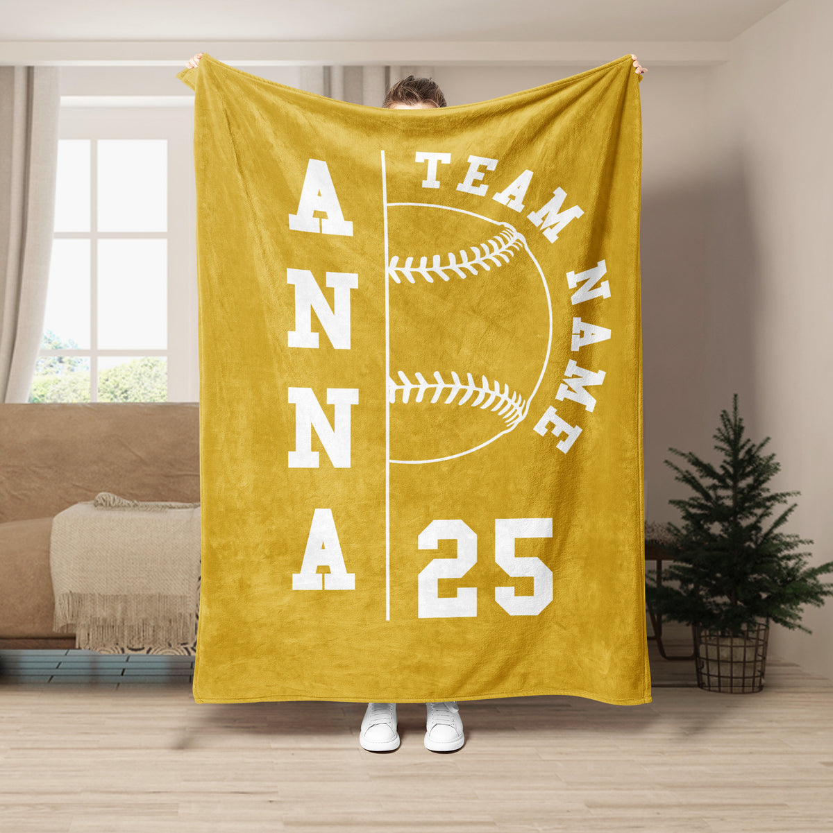 Gold softball throw blanket with white stitched ball artwork and strong team spirit design