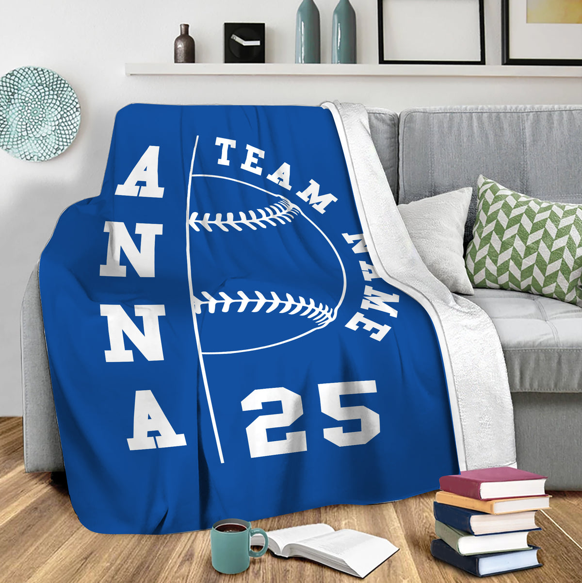 Blue softball throw blanket draped over a sofa in a cozy living room setting