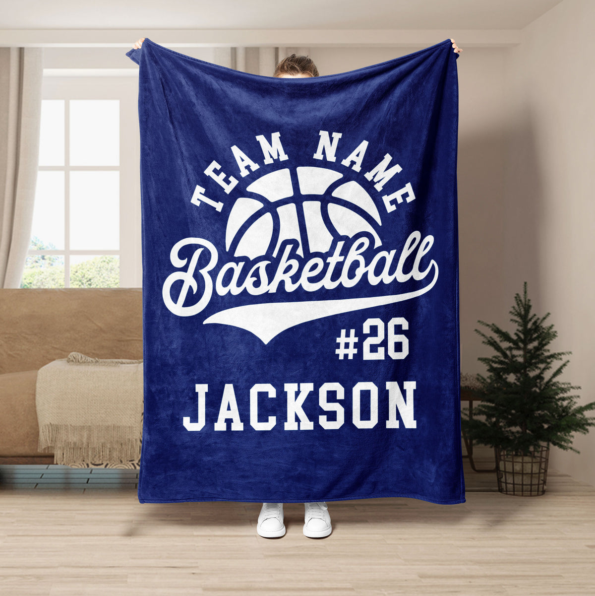 Navy basketball throw blanket displayed in a living room with bold white sports artwork