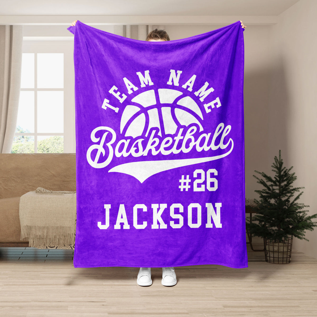 Purple basketball throw blanket displayed in a living room with bold white basketball artwork