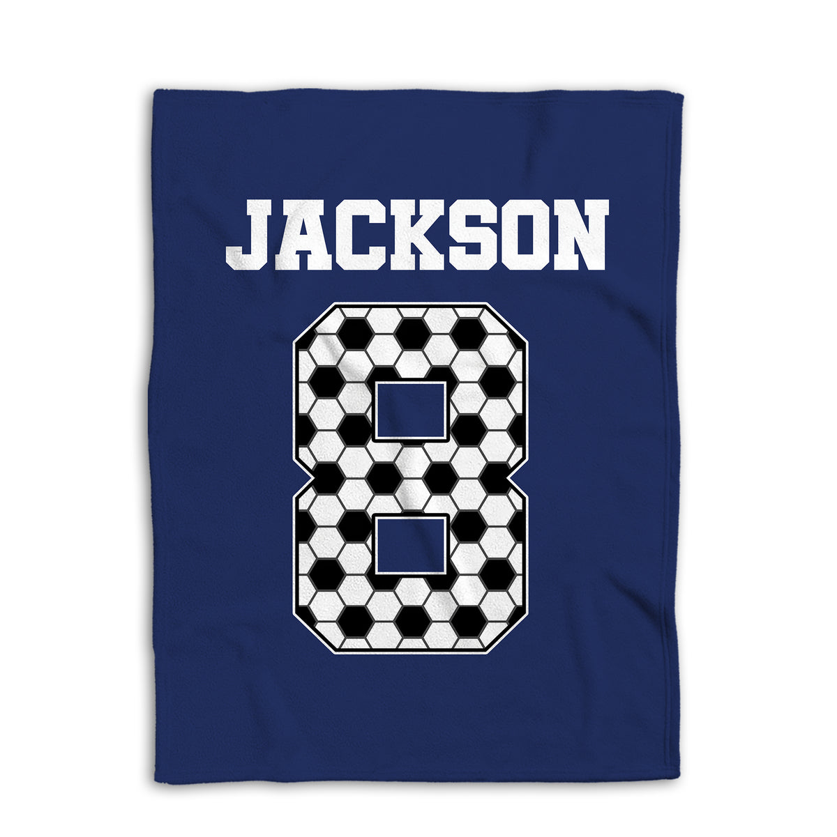 Navy soccer blanket laid flat with large black and white soccer ball artwork