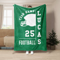Green football blanket displayed upright with a white helmet silhouette and bold football design