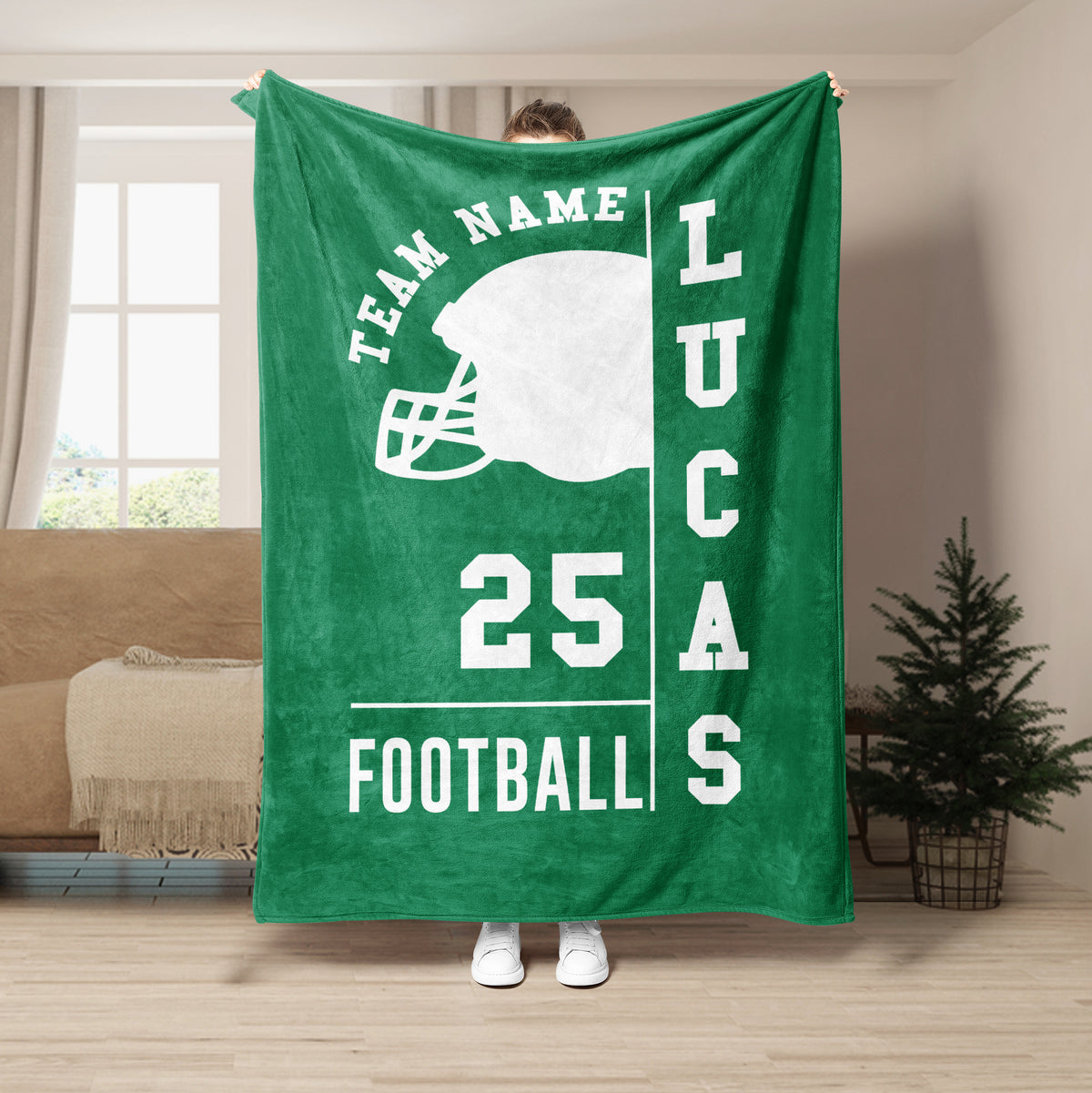 Green football blanket displayed upright with a white helmet silhouette and bold football design