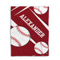 Red baseball throw blanket featuring oversized baseball artwork and diagonal white stripe accents