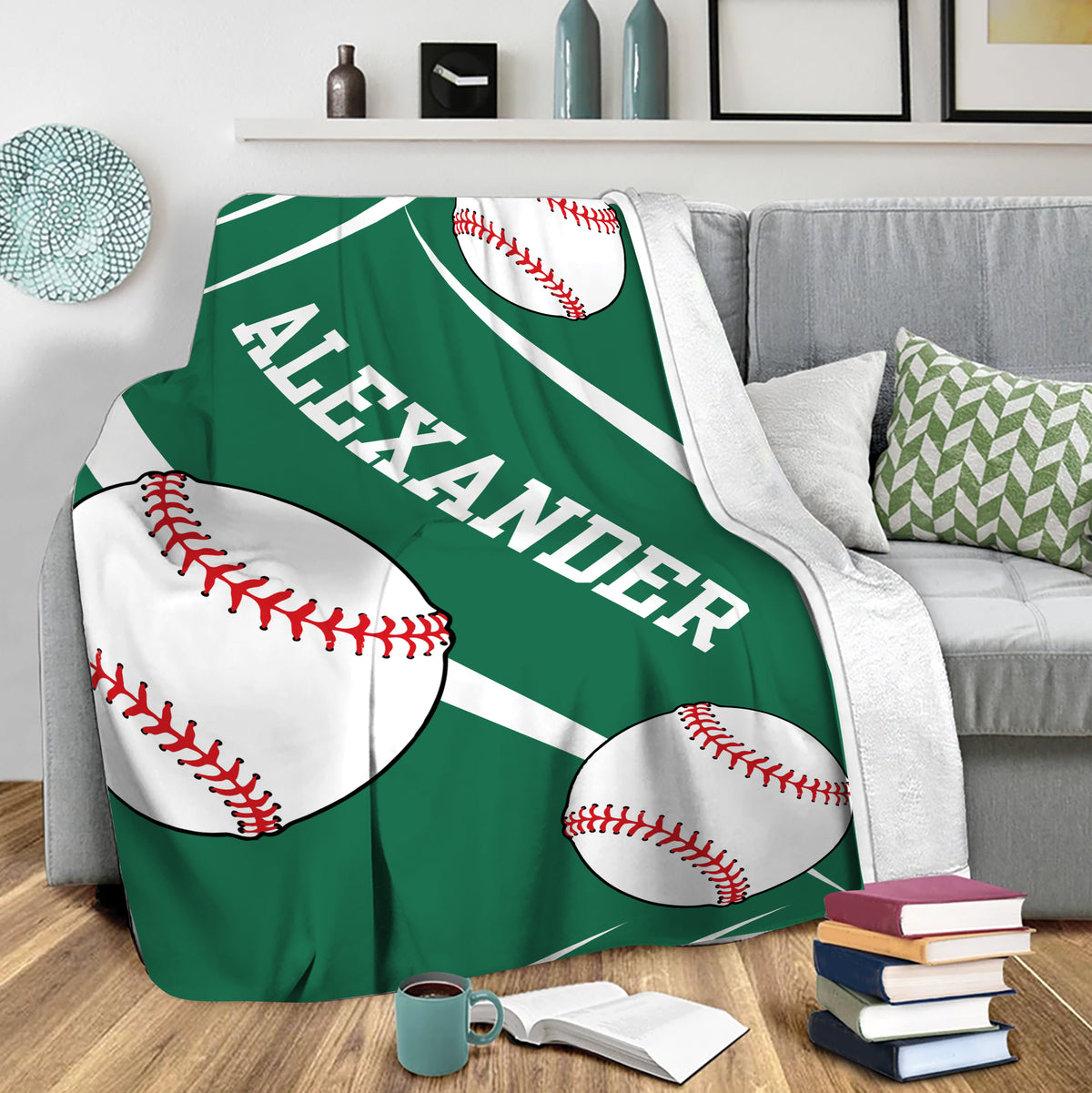 Green baseball blanket draped over a sofa with oversized baseballs and bold white stripe details