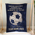 Soccer coach blanket displayed on a bedroom frame with team-focused soccer ball artwork