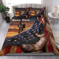 Lineman quilt blanket styled on a bedroom bed with utility pole artwork, stars, stripes, and warm sunset tones