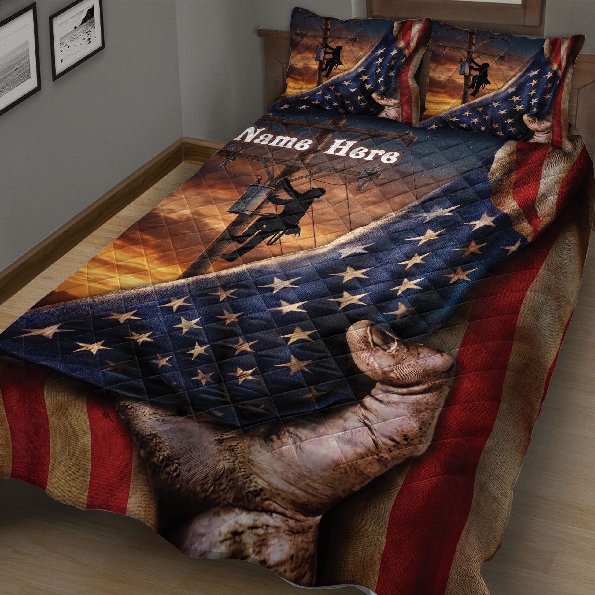 Close view of lineman quilt bedding with utility worker silhouettes, star pattern, sunset artwork, and patriotic stripes