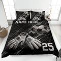 Black soccer quilt bedding set displayed on a bed with soccer balls and goalkeeper gloves