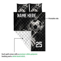 Soccer quilt showing the printed front and white diamond-quilted reverse side