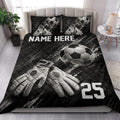 Black soccer quilt blanket styled in a bedroom with soccer ball and goalkeeper glove artwork