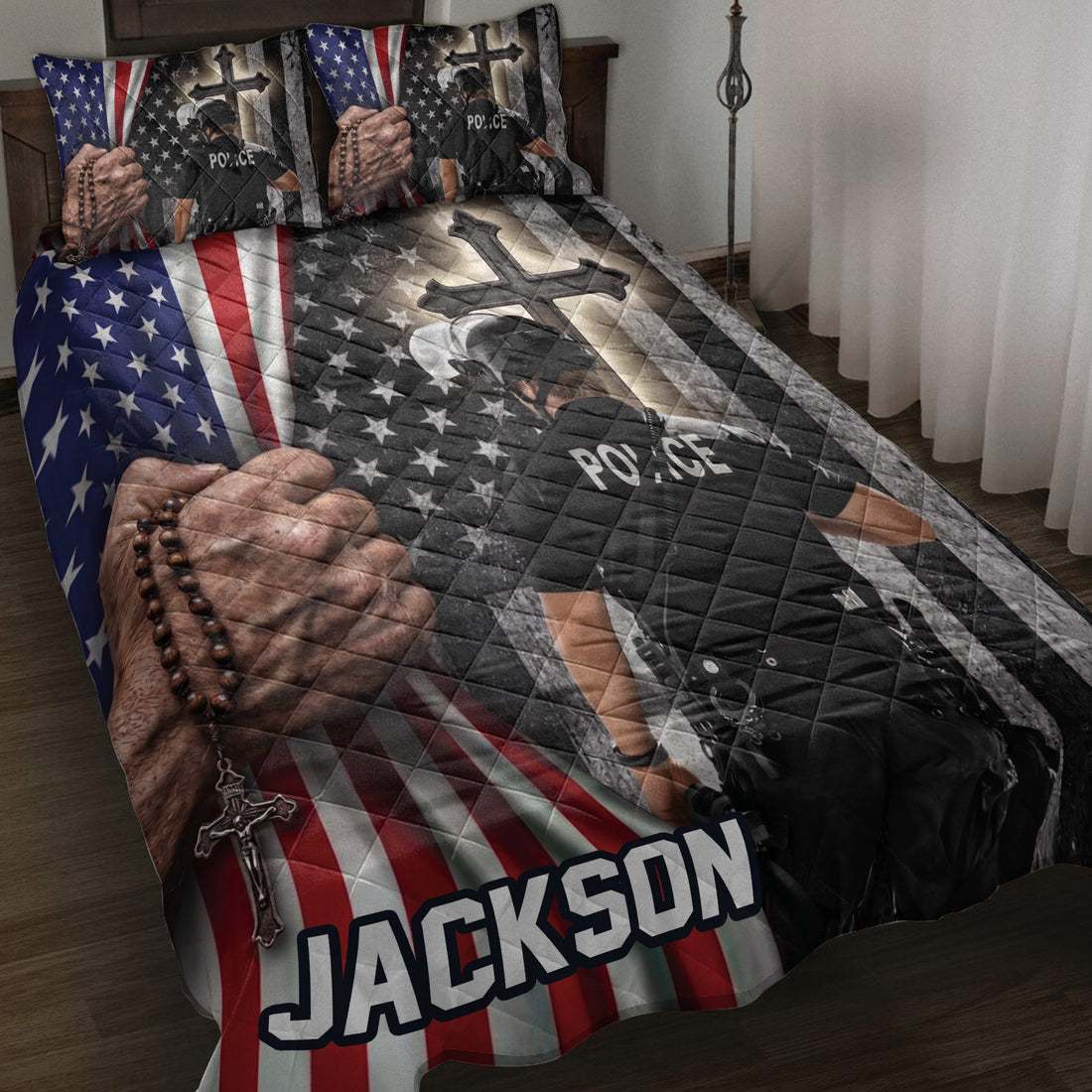 Police quilt blanket displayed on a bed with American flag stripes, stars, crosses, and law enforcement artwork