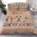 Cheerleading quilt bedding styled in a bright bedroom with colorful cheerleader silhouettes and flowers