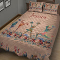 Floral cheerleading quilt blanket displayed on a bed with vibrant watercolor cheerleader artwork