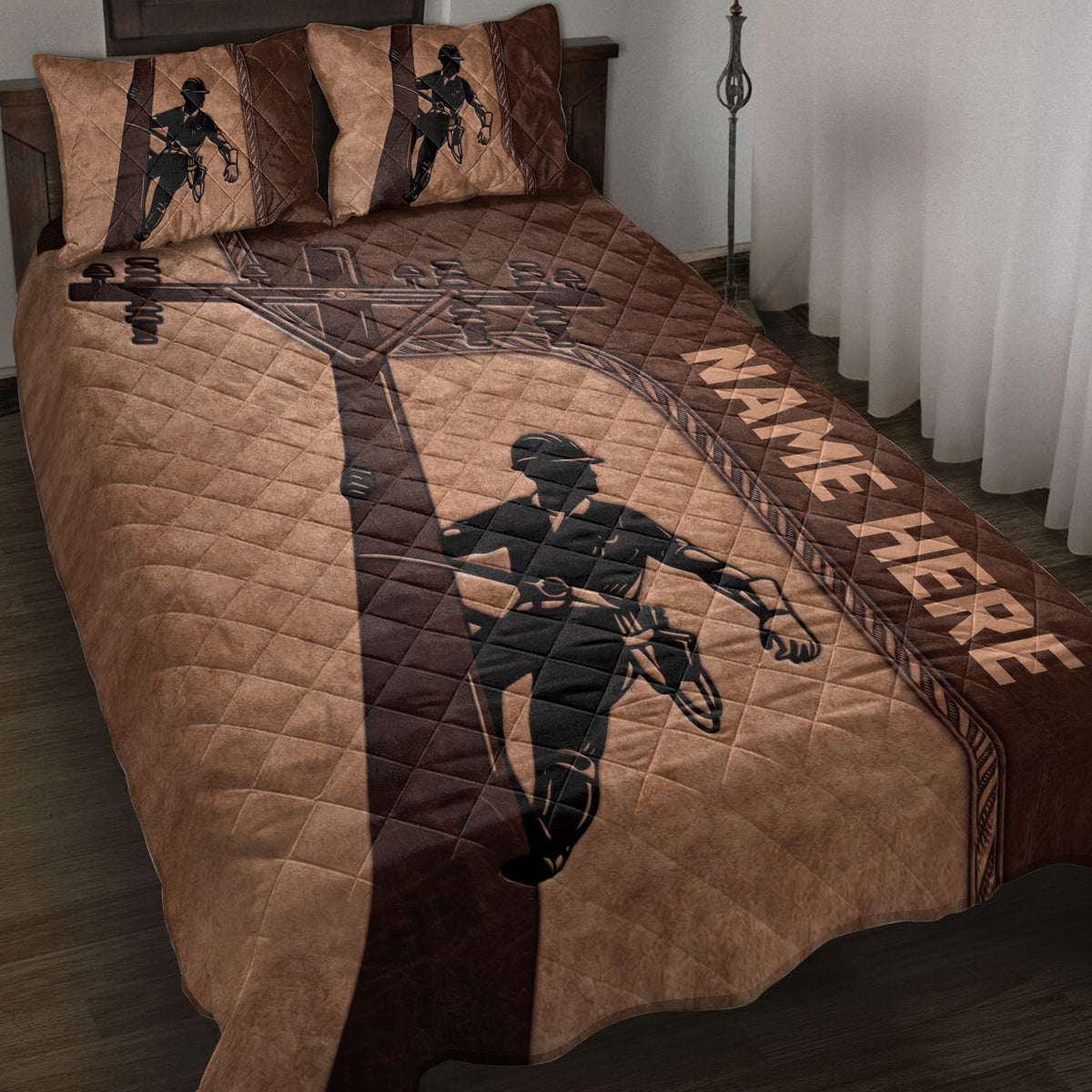Lineman quilt blanket displayed on a bed with power lineworker artwork in brown and black